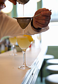 Pisco Sour cocktails on a bar countertop