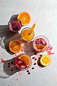 Fresh squeezed pomegranate and orange juice in glasses