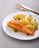 Salmon filet with new potatoes and lemon and caper butter