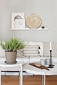 White couch with scatter cushions and candles and lavender on coffee tables