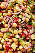 Indian chickpea salad with potatoes, cucumber and pomegranate seeds