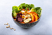 A golden bowl with vegetables and turmeric
