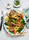 Grilled lamb chops with vegetables and pasta