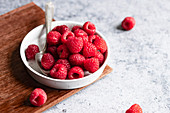 Fresh raspberries in a shallow dish