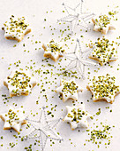 Star cookies with icing and pistachios
