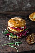 Goat cheese burger with plum chutney and beetroot salad