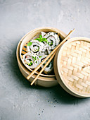 Vegan sushi rolls in a steaming basket