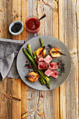 Grilled Denver Cut Steak with Green Asparagus and Onions