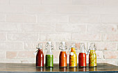 Colorful BBQ sauce variations in glass bottles