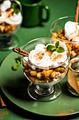 Apple pie cup with cinnamon and whipped cream