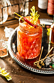 Bloody Mary in a glass on a silver platter