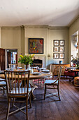 Wooden breakfast table and framed botanc arwork in 18th century mansion