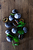 Plums on a wooden background