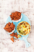 Warm mozzarella and spinach dip with beetroot crackers