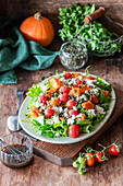 Pumpkin salad with roasted tomatoes and cottage cheese