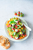Tomato salad with pesto and mozzarella