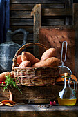 Still life with sweet potatoes in a basket