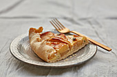Apiece of apple pie on ceramic plate