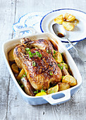 Slowly baked chicken with potatoes and garlic