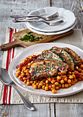 Stewed chickpeas with tomatoes and baked pork