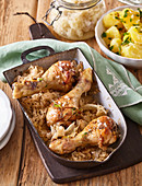 Baked chicken drumsticks with sauerkraut