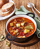 Sauerkraut soup with red pepper sausage