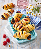 Pastries with poppy seed and raspberries