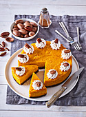 Pumpkin pie with whipped cream and pecans