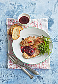 Pork cutlets with black currant sauce