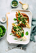 Sweet potatoes filled with white asparagus and herb sauce