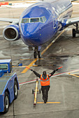 Ground crew directing an aircraft