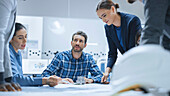 Team of engineers and specialist talking in a meeting