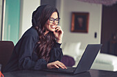 Young woman working in home office