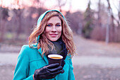 Woman walking with hot drink