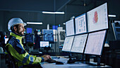 Engineer in factory control room