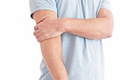 Man holding his elbow in pain