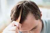 Man combing his hair