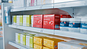 Shelves lined with medications in a pharmacy