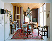 Suspended shelf above console table and old TV in background