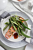 Steamed salmon with asparagus and wild garlic