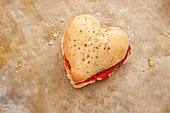 Heart-Shaped Pizza Dough Sandwich with Tomato, Mozzarella and Basil
