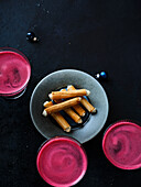 Beetroot drinks and crispy rolls with horseradish foam