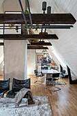 Black leather chairs, dining area with marble table and cantilever chairs in loft apartment