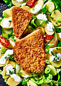 Vegetarian 'schnitzel' on potato salad