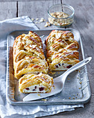 Plait with fresh cheese and cranberries