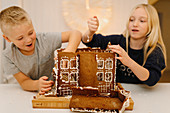 Children making gingerbread house