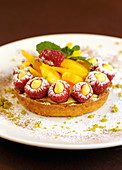 Cream tart with nectarines and raspberries