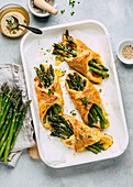 Asparagus puff pastries with cheese and thyme honey