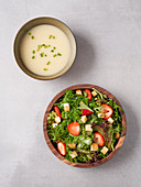 Cream of asparagus soup and wild herb salad (vegan)