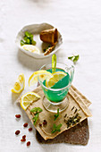 Detox water with green tea, spirulina, raisins, mint and lemon